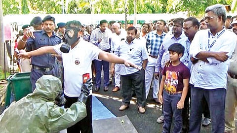 People watch the emergency drill being held at Kalpakkam