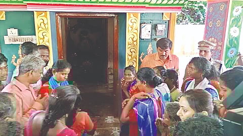 Dalit villagers, led by Collector Kavitha Ramu (inset), offering prayers at the temple in
Vengavayal village in Pudukottai on Tuesday