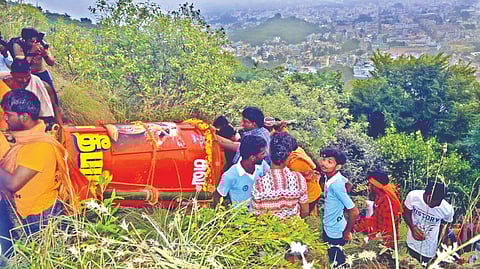 A group of 50 Deepa Nattars carrying the giant cauldron atop Annamalai hills in Tiruvannamalai on Monday.