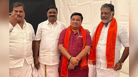 O Panneerselvam in a saffron shawl