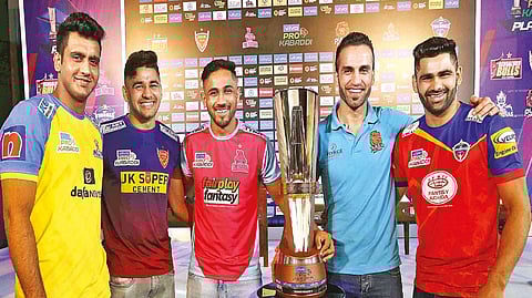 Tamil Thalaivas defender Sahil Gulia, Dabang Delhi captain Naveen Kumar, Jaipur Pink Panthers skipper Sunil Kumar, Puneri Paltan captain Fazel Atrachali and UP Yoddhas skipper Pardeep Narwal with the Pro Kabaddi League trophy