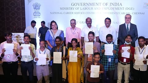 Ma Subramanian providing offer letter to candidates at job fair organised exclusively for rainee placement of persons with disabilities.