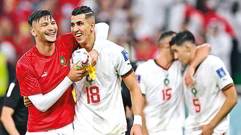 (L) Morocco?s Achraf Dari; Jawad El Yamiq (R)