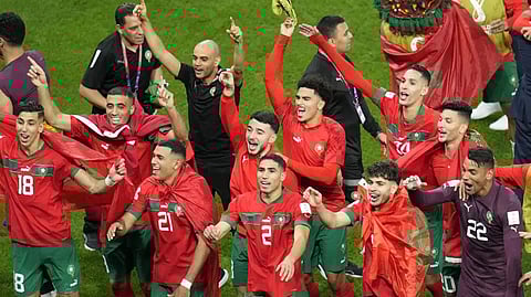 Morocco players celebrate at the end of the World Cup round of 16 soccer match between Morocco and Spain, at the Education City Stadium in Al Rayyan, Qatar, Tuesday, Dec. 6, 2022.