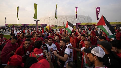Moroccan supporters arrive ahead of the World Cup quarterfinal soccer match between Morocco and Portugal, at Al Thumama Stadium in Doha, Qatar