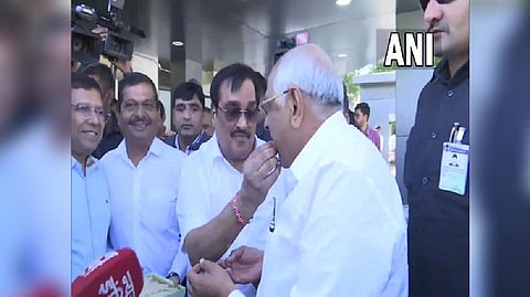 CM Patel, CR Paatil exchange sweets
