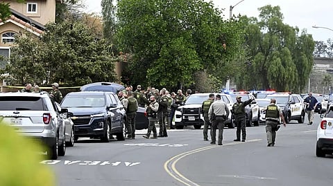 Riverside County Sheriff's stand at the corner of Golden West Ave and Condor Drive in Jurupa Valley, Calif. Thursday, Dec. 29, 2022. Authorities say a Southern California sheriff?s deputy has been shot during a traffic stop.