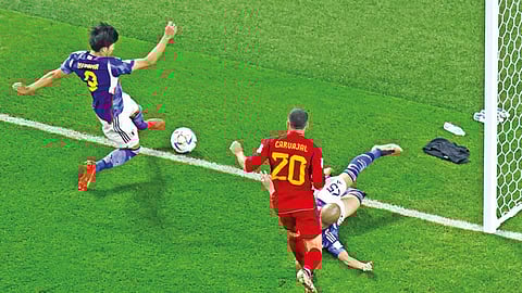 A sliver of the ball was in play when Kaoru Mitoma (left) crossed for the second goal