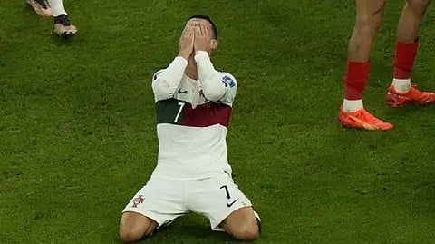 Portugal's Cristiano Ronaldo reacts after teammate Pepe missed a chance to score during the World Cup quarterfinal soccer match between Morocco and Portugal, at Al Thumama Stadium in Doha, Qatar