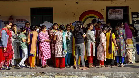 Voting began at 8 am across 14,975 polling stations.