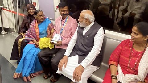 Modi travelling in Mumbai Metro train