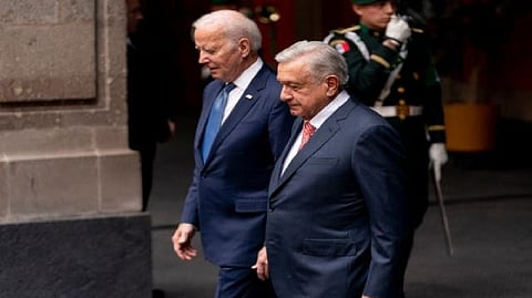 President Joe Biden walks with Mexican President Andres Manuel Lopez Obrador