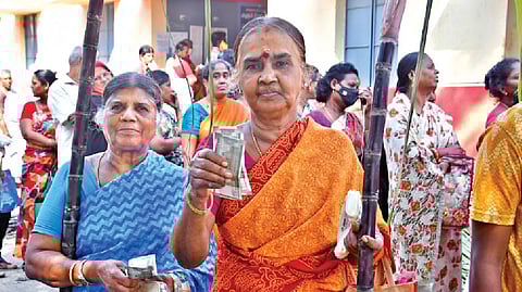 People coming out of PDS shop after collecting the Pongal gift hamper in Chennai on Monday.