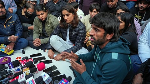Vinesh Phogat with wrestlers Sakshi Malik and Bajrang Punia and others at a press conference regarding wrestlers' protest against the Wrestling Federation of India.