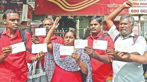 Makkal Athigaram volunteers posting ?Go back Ravi? postcards at Anna Salai HPO on Wednesday.