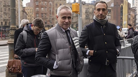 Fashion designer Thom Browne waits in line outside Manhattan federal court