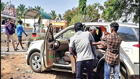 One of the participants taking away his rooster from Poolanvalasu village in Karur on Saturday