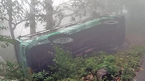 The bus that has overturned in Sirumalai