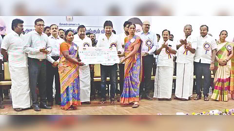 Youth Welfare and Sports Development Minister Udhayanidhi Stalin handing over welfare aid to women beneficiaries in Salem on Friday.