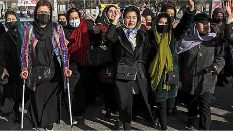 Afghan women chant slogans during a protest against the ban on university education for women, in Kabul, Afghanistan.