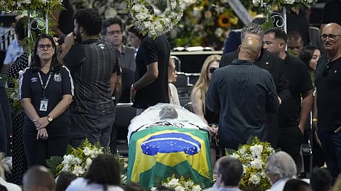 Pel?'s body was kept in a coffin, draped in the flags of Brazil