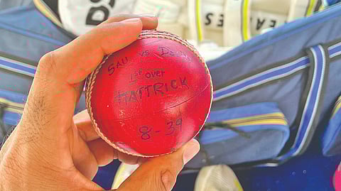 Jaydev Unadkat poses with the hat-trick ball