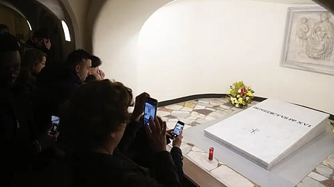 Faithful visit the tomb of late Pope Emeritus Benedict XVI inside the grottos of St. Peter's Basilica