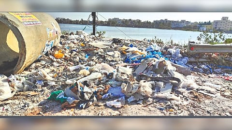Garbage disposed in the open near Narayanapuram Lake in Pallikaranai.