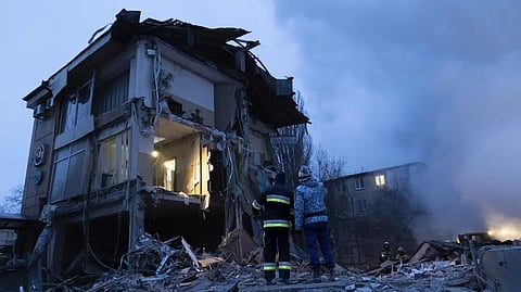 Smoke rises as Donetsk's emergency employees work at a site