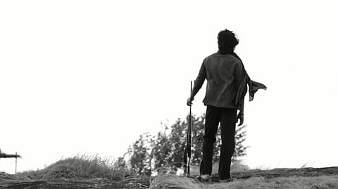 Dhanush holding a gun