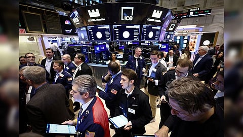 Traders work on the trading floor at the New York Stock Exchange (NYSE) in New York City