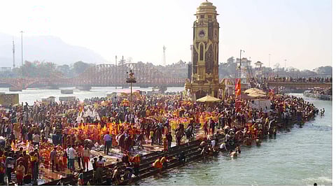 Devotees arrive at Har Ki Paudi ghat to fill the Ganga water to perform Jalabhishek on Mahashivratri, in Haridwar.