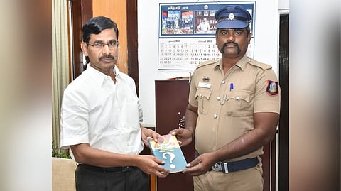 Iraianbu invited S Sangan, to the Secretariat and presented the book "Namakkul Sila Kelvigal"