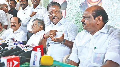 Ousted AIADMK leader O Panneerselvam and his supporters at a press meet in Chennai on Friday