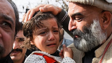 Daughter of Irfan Khan, a police officer, who along with other police officers was killed, weeps during a protest by police officers to condemn the suicide blast in a mosque in Peshawar