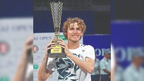 Australia?s Max Purcell poses with the Chennai Open Challenger trophy