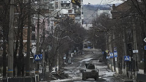 Ukrainian soldiers ride in a Humvee in Bakhmut, Donetsk region, Ukraine