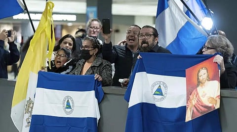 Supporters of Nicaraguan political prisoners chant at Washington Dulles International Airport