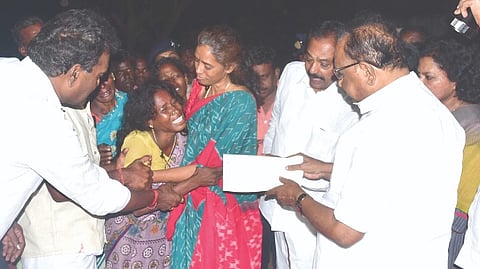 Law Minister S Regupathy consoling the sobbing parents in Pudukkottai on Thursday