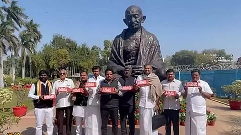 Tamil Nadu MP's holding bricks that read 'AIIMS'