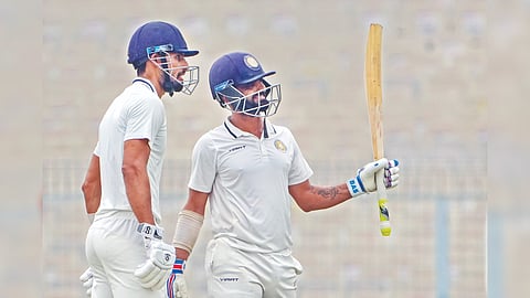 Saurashtra batter Arpit Vasavada (right) celebrates after scoring a half-century