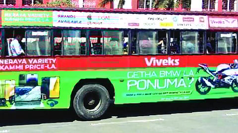 Full-body ads cover MTC buses; registration numbers missing on rear