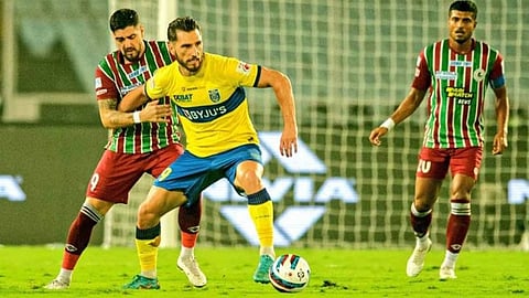 Action between Kerala Blasters (yellow) and ATK Mohun Bagan