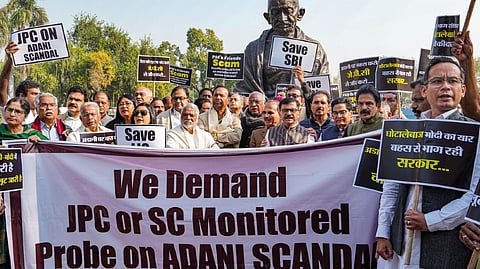 Opposition parties? MPs stage a protest over Adani row in the Parliament complex, in New Delhi on Monday.