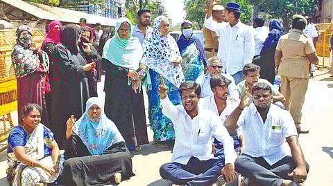 A group of voters protesting lack of adequate facilities in a polling centre in Karungalpalayam, Erode on Monday