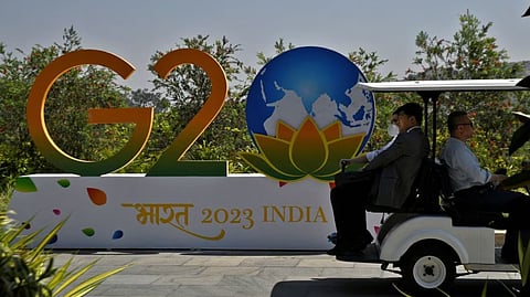 Delegates ride in a buggy at G20 finance officials meeting venue near Bengaluru, India, February 22, 2023.