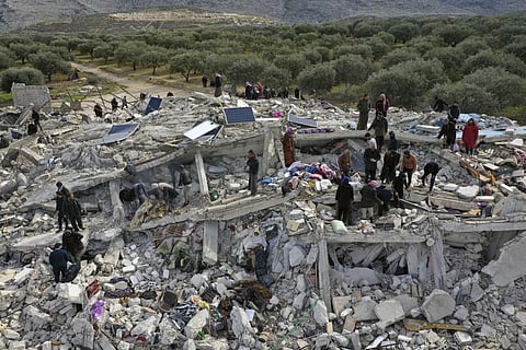 Rescue work in a collapsed building in Harem bordering Turkey and Syria