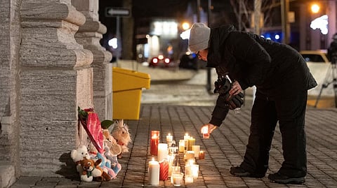 A woman lighting a candle
