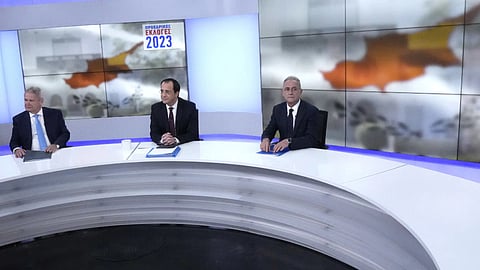 Presidential candidates Andreas Mavrogiannis, left, who is backed by the left-wing AKEL party, independent and former foreign minister Nicos Christodoulides, center, and the right-wing Averof Neophytou are seated prior to their live televised debate in capital Nicosia, Cyprus