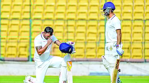Sheldon Jackson celebrates scoring a century